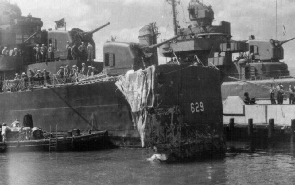 Aircraft carrier  Cowpens  collision.<br>Bent bow, along pier in Pearl Harbor; 19OCT1943.
